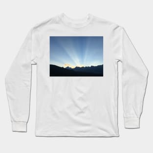 Sun peeking behind the mountains at sunset Long Sleeve T-Shirt